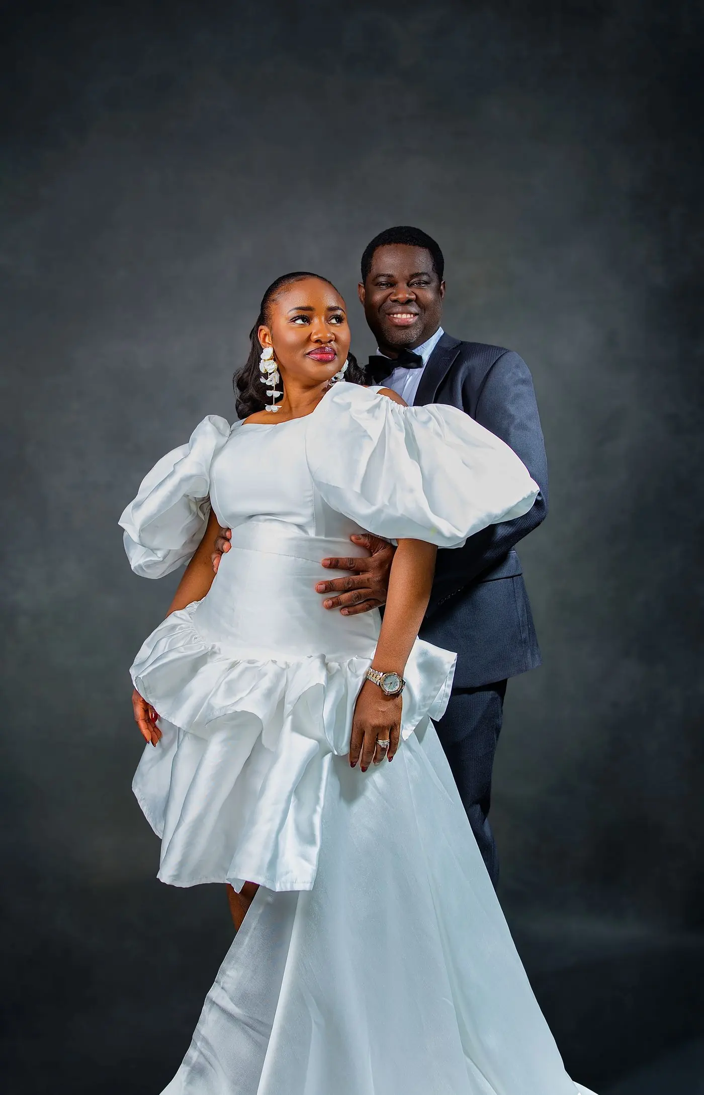 Wedding couple portrait in Calgary: bride in a white gown with the groom behind her