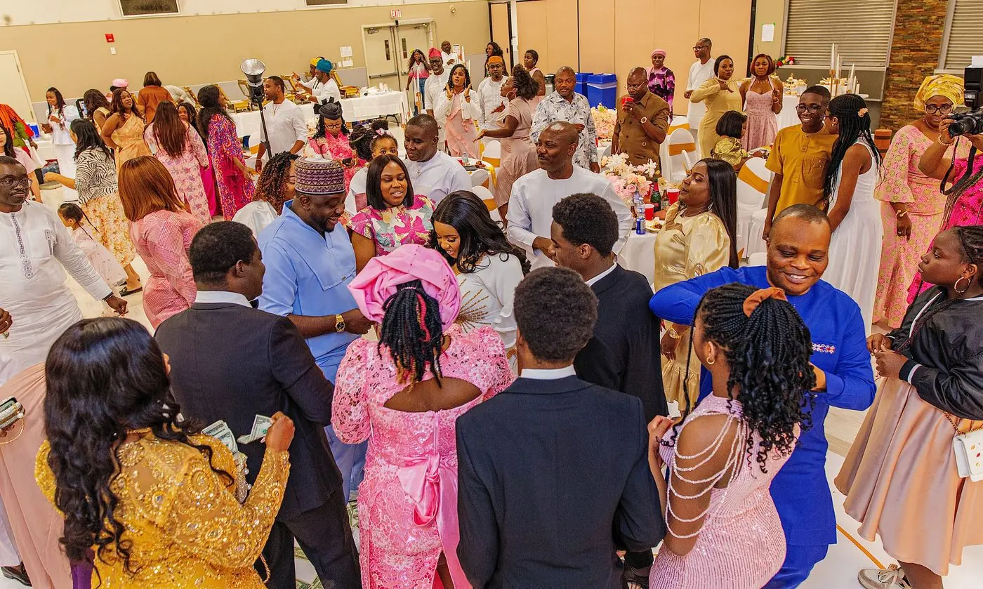 Money spraying on the dance floor at a Nigerian wedding reception in Calgary